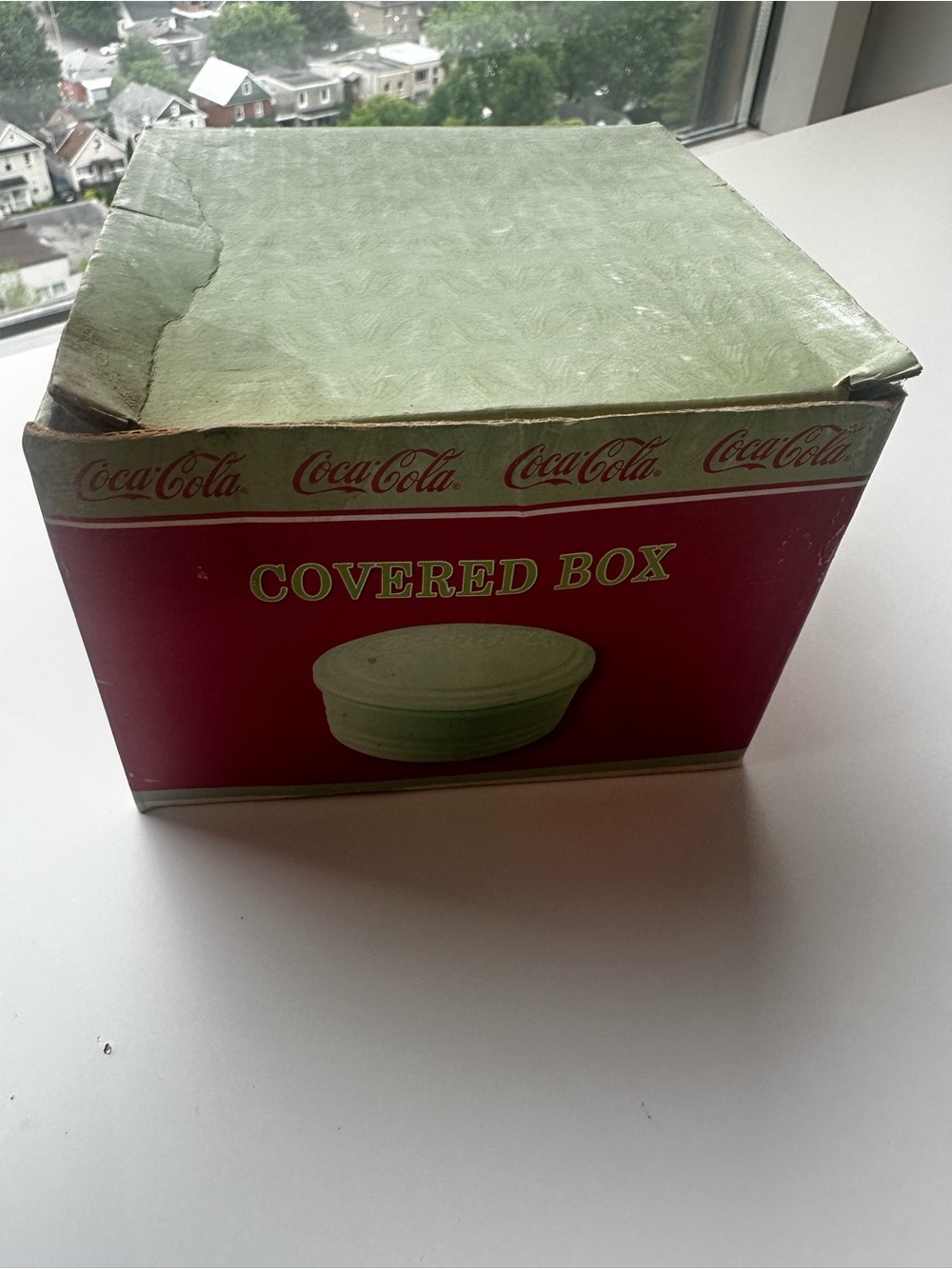 Vintage jadiete Coca Cola Lid in vintage box. Base is broken.